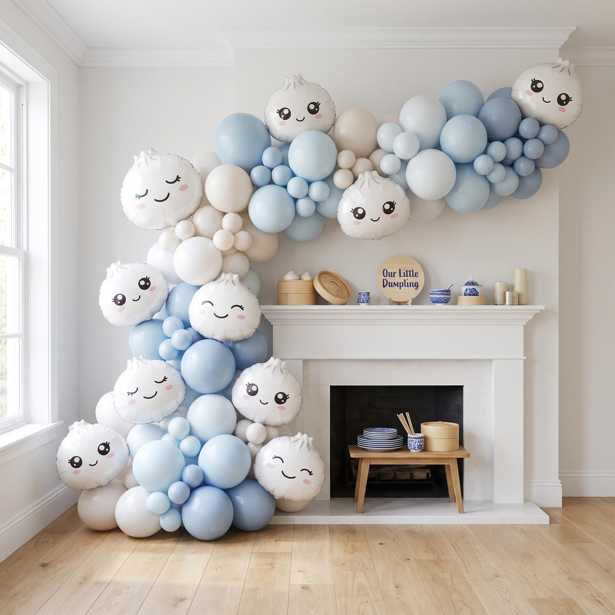 Our Little Dumpling (Blue) balloon garland installed on a wall at home