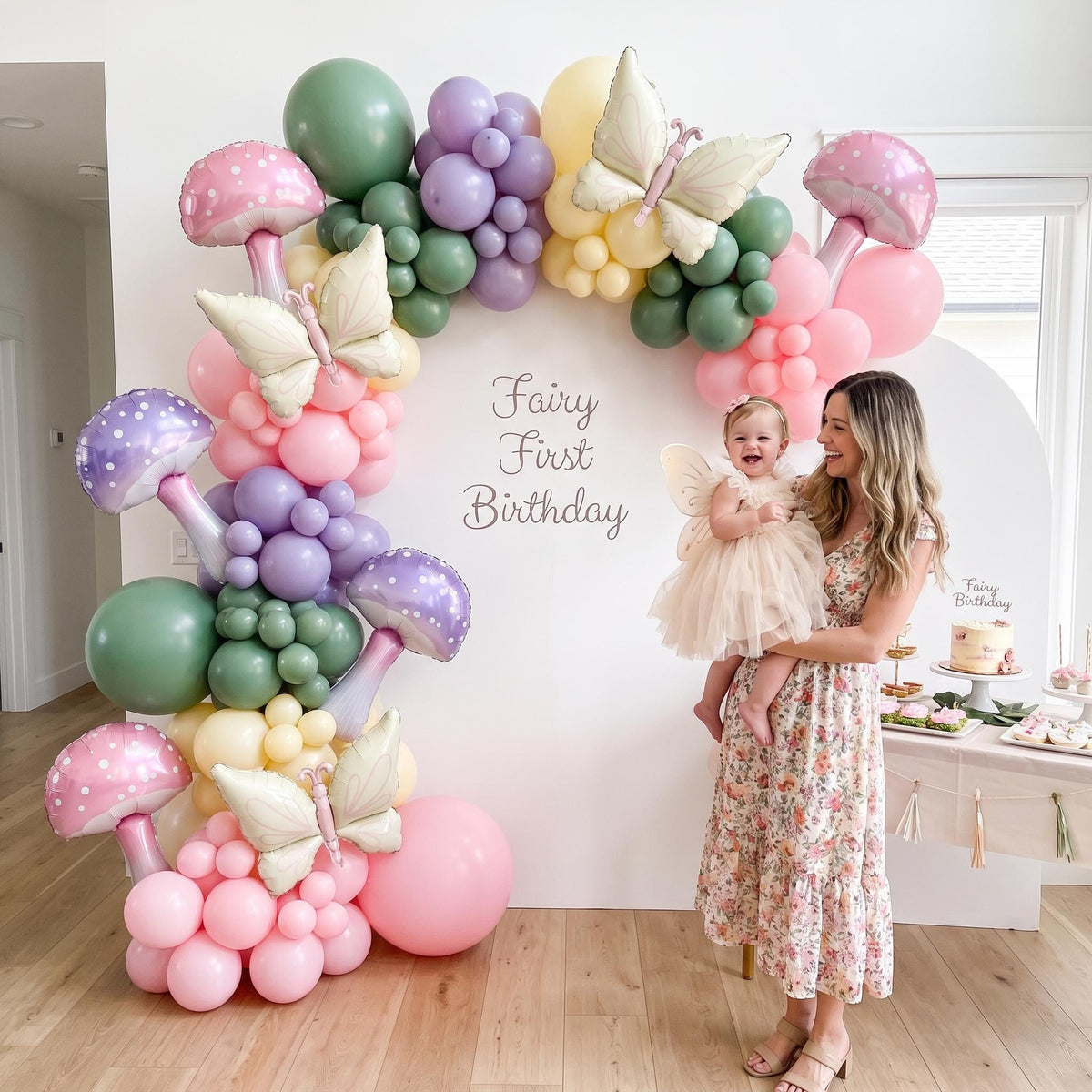 Fairy First Birthday balloon garland styled at a party