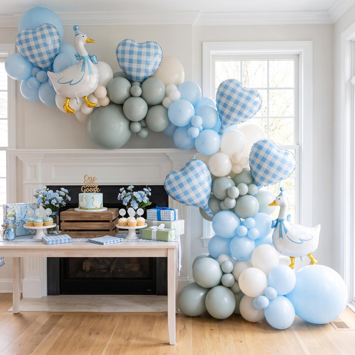 One Silly Goose (Blue) balloon garland installed on a wall at home