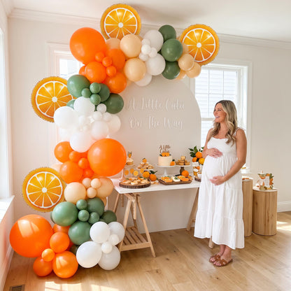 A Little Cutie On The Way balloon garland styled at a party