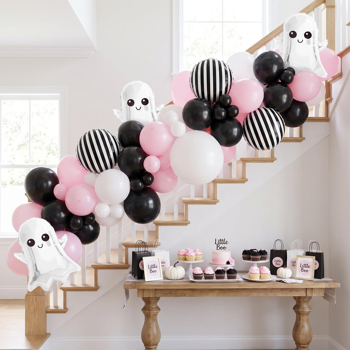 Little Boo's First Halloween balloon garland installed on a wall at home