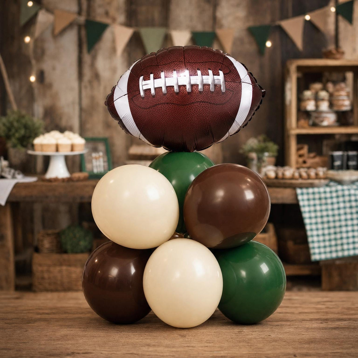 First Year Down balloon tower: 8 latex balloons topped with a Football foil