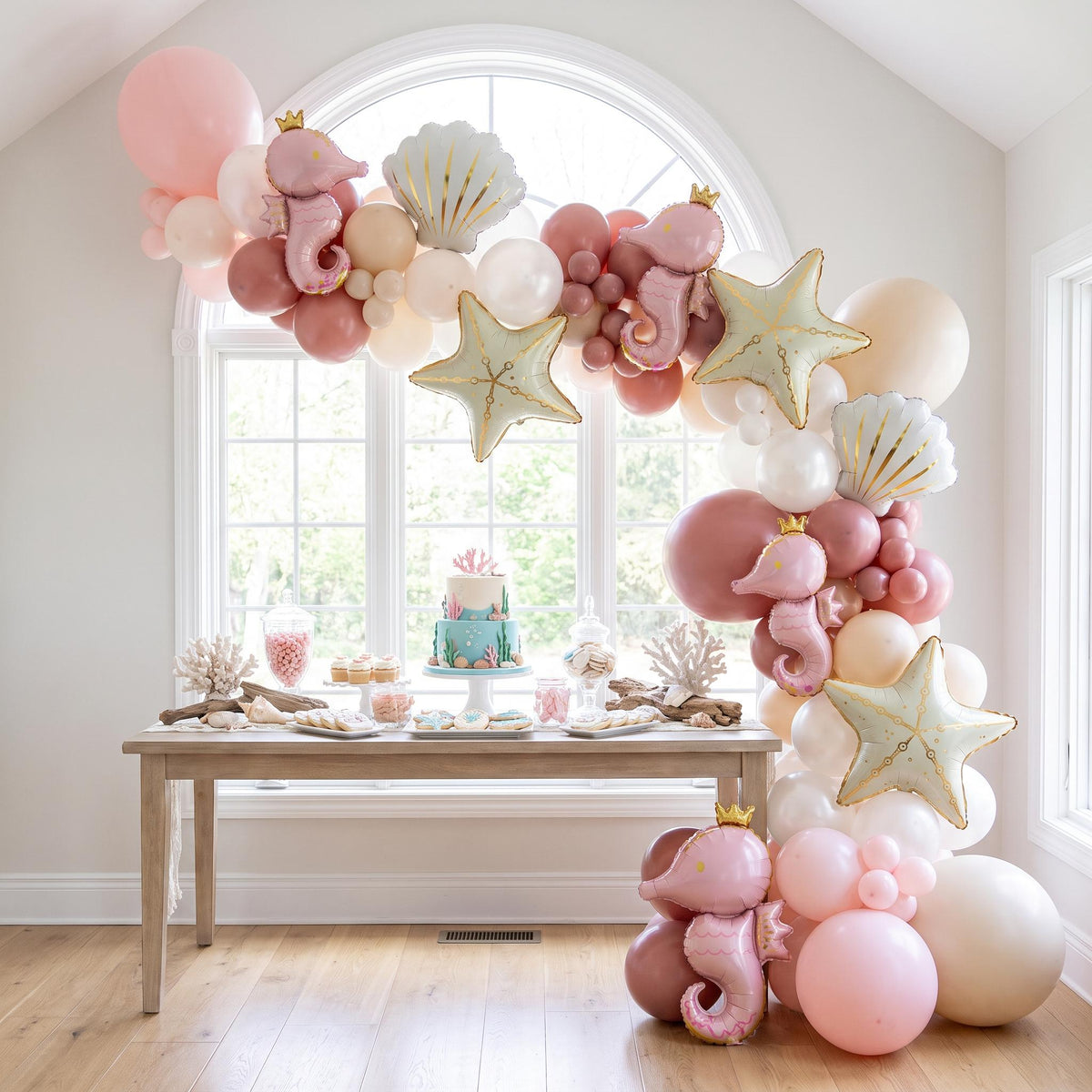 Sea You Soon (Pink) balloon garland installed on a wall at home