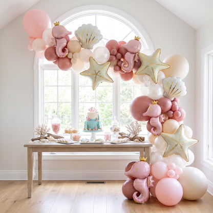 Sea You Soon (Pink) balloon garland installed on a wall at home