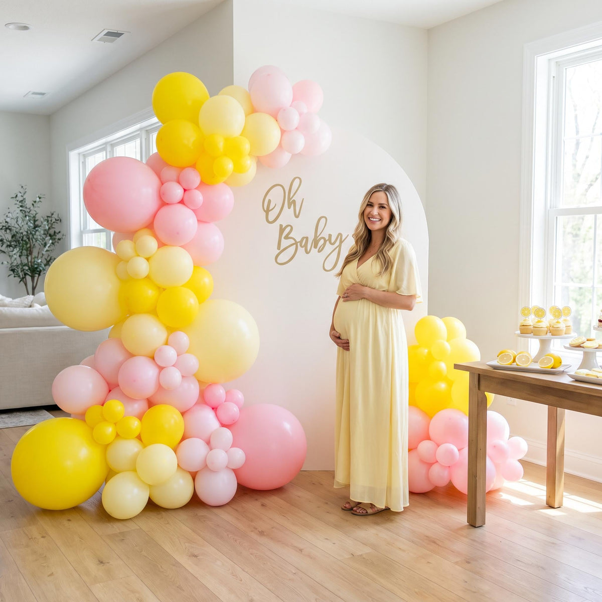 A Little Lemon balloon garland styled at a party