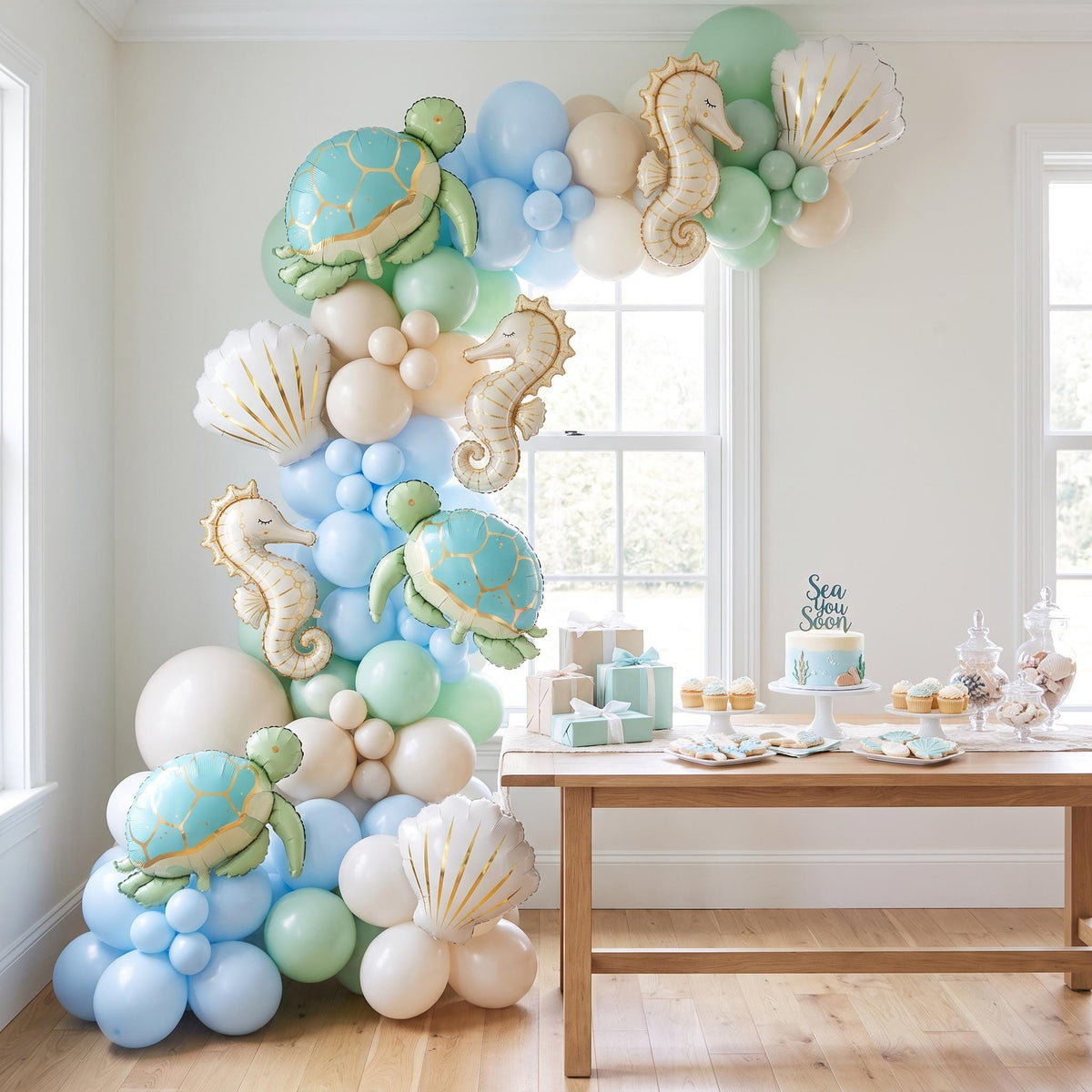 Sea You Soon (Turtle) balloon garland installed on a wall at home