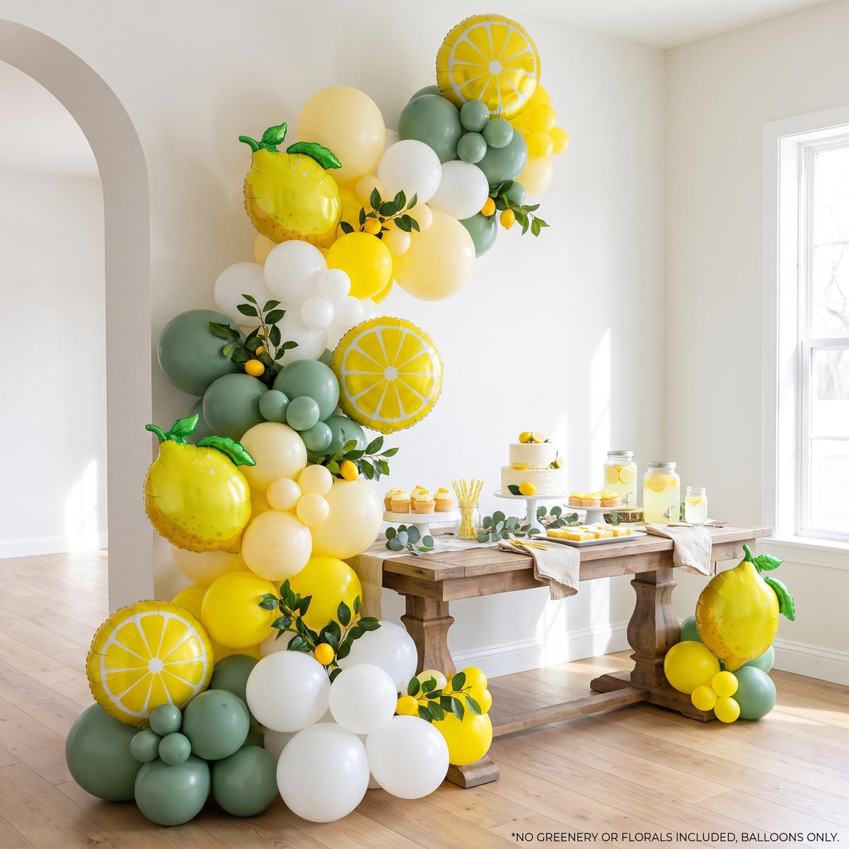 Freshly Squeezed (Eucalyptus) balloon garland installed on a wall at home