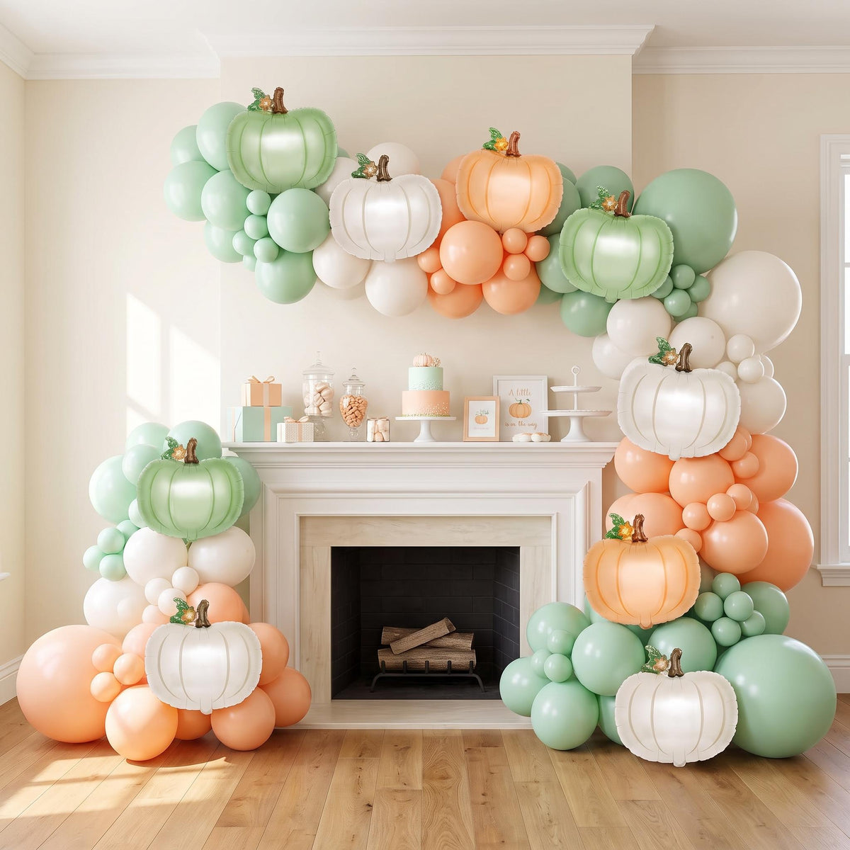 A Little Pumpkin Is On The Way balloon garland installed on a wall at home