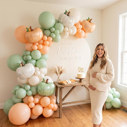 A Little Pumpkin Is On The Way balloon garland styled at a party