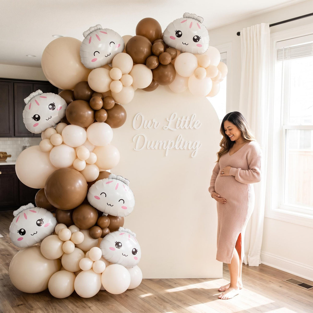 Our Little Dumpling (Neutral) balloon garland styled at a party