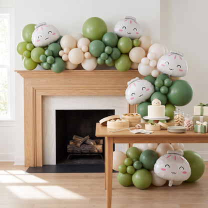 Our Little Dumpling (Matcha Cream) balloon garland installed on a wall at home