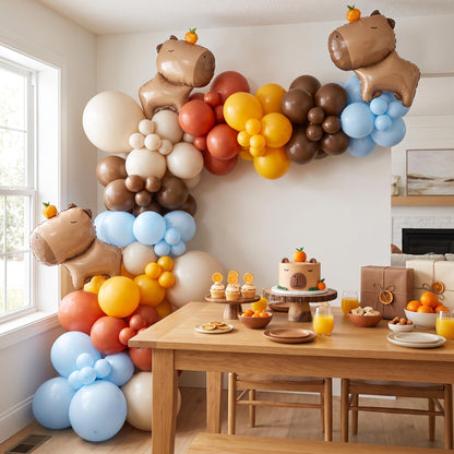 Chill Capybara balloon garland installed on a wall at home