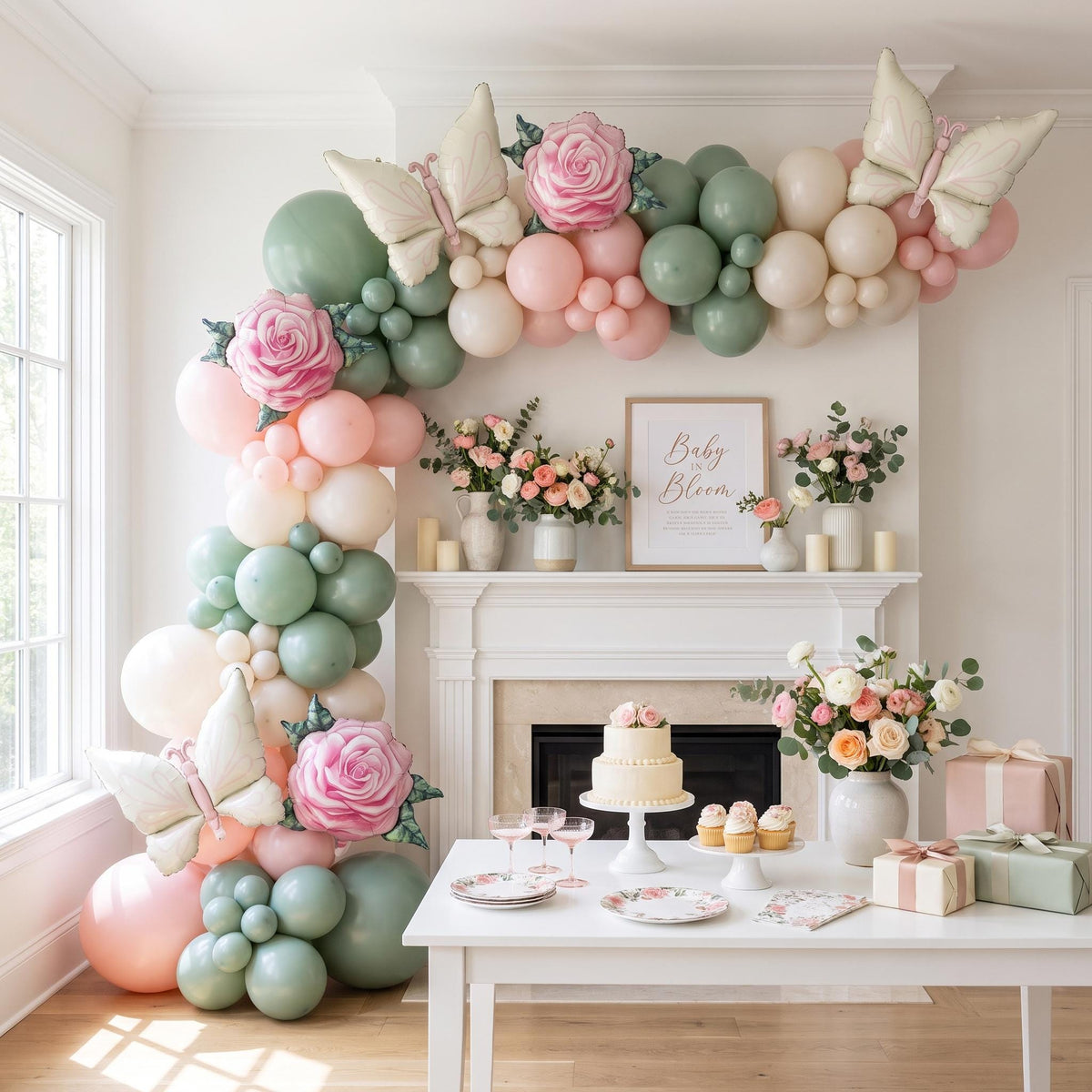 Baby In Bloom balloon garland installed on a wall at home