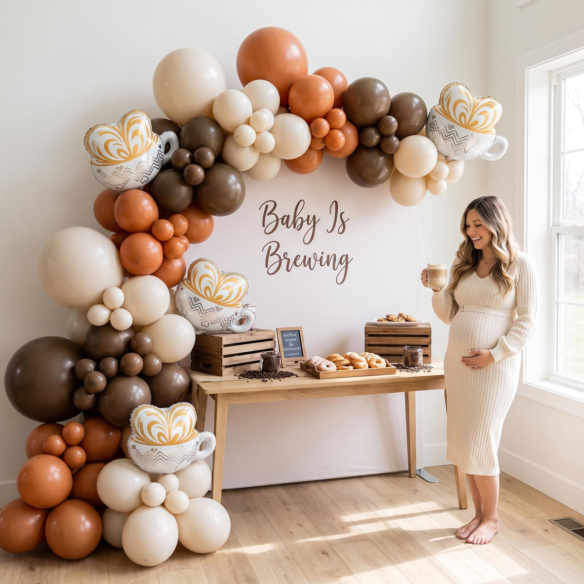 Baby Is Brewing balloon garland styled at a party