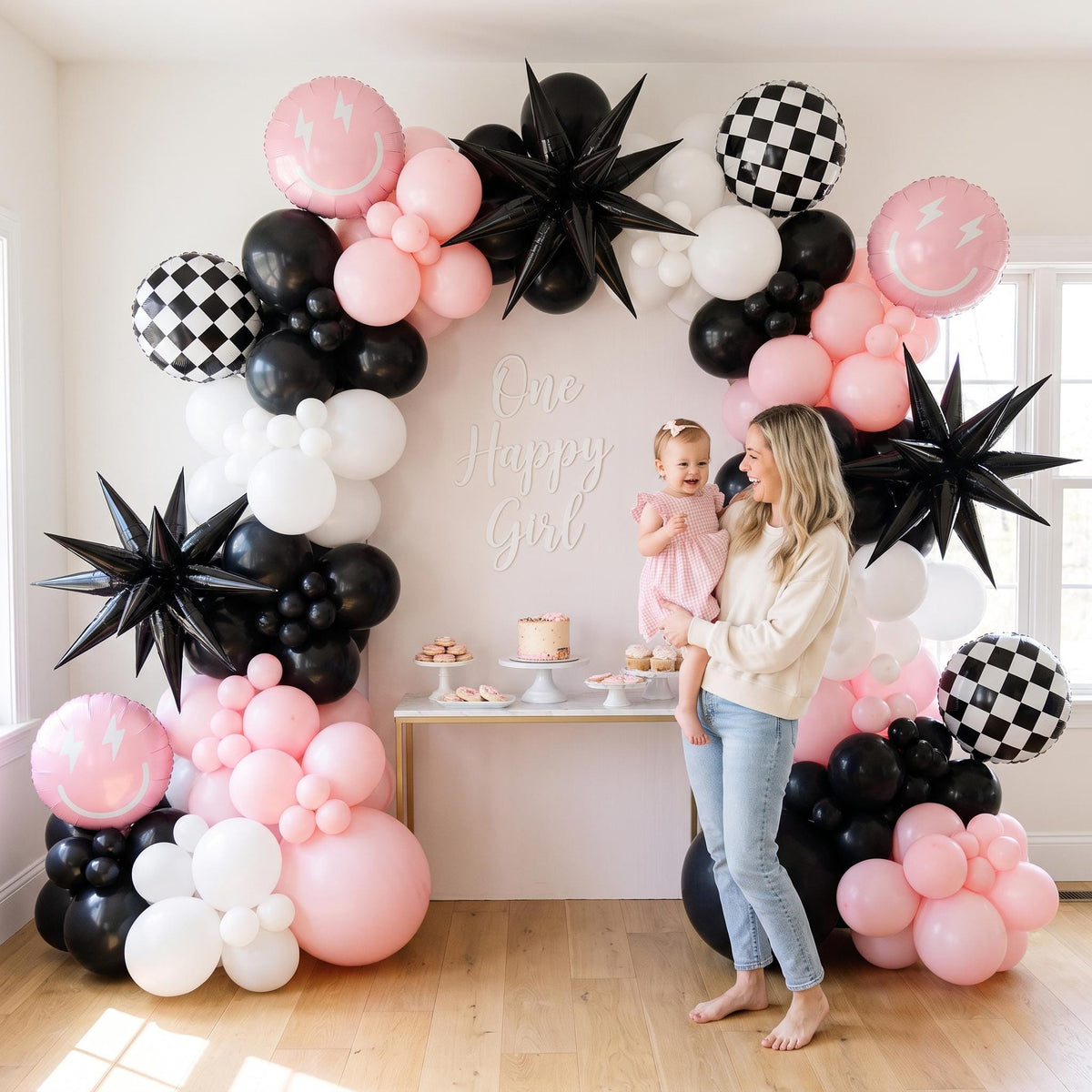 One Happy Girl (Pink) balloon garland styled at a party