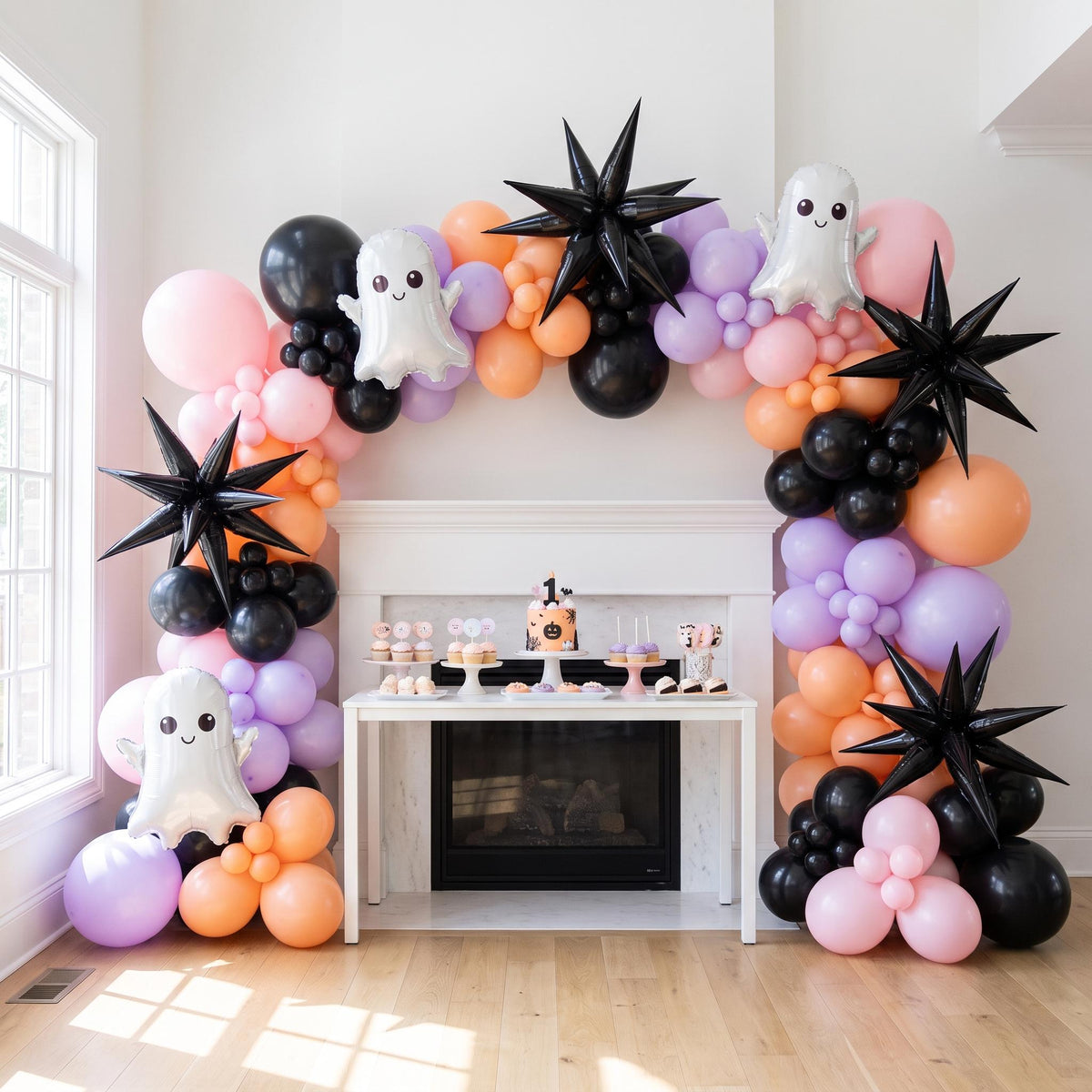 Spooky One balloon garland installed on a wall at home