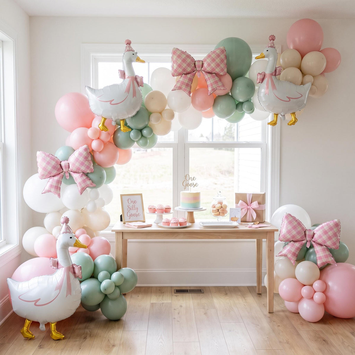 One Silly Goose (Pink) balloon garland installed on a wall at home