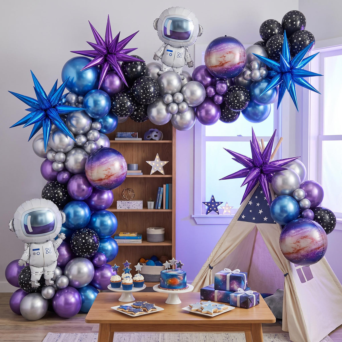 Out Of This World balloon garland installed on a wall at home