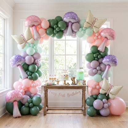 Fairy First Birthday (Wildflower) balloon garland installed on a wall at home