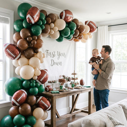 First Year Down balloon garland styled at a party