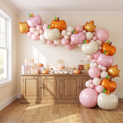 A Little Pumpkin Is On The Way balloon garland installed on a wall at home