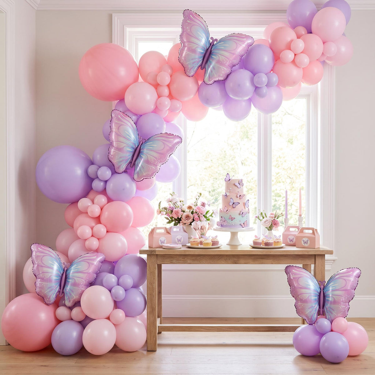 Purple Butterfly balloon garland installed on a wall at home