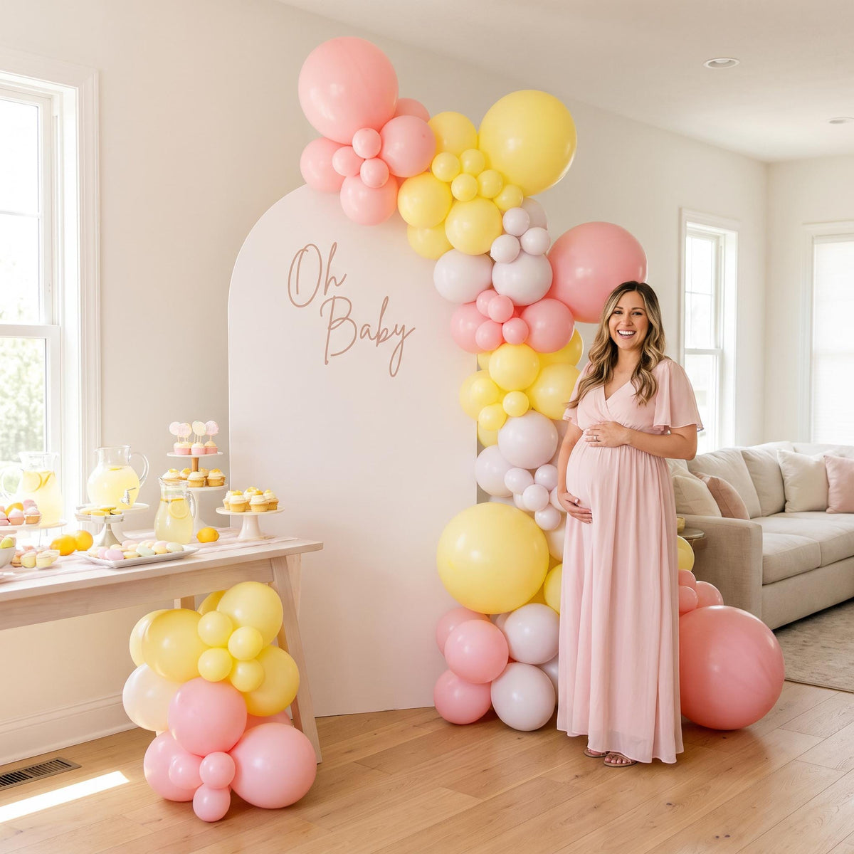Pink Lemonade balloon garland styled at a party