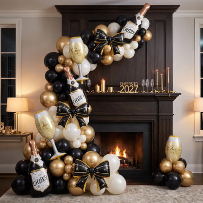 Cheers To 2027 balloon garland installed on a wall at home