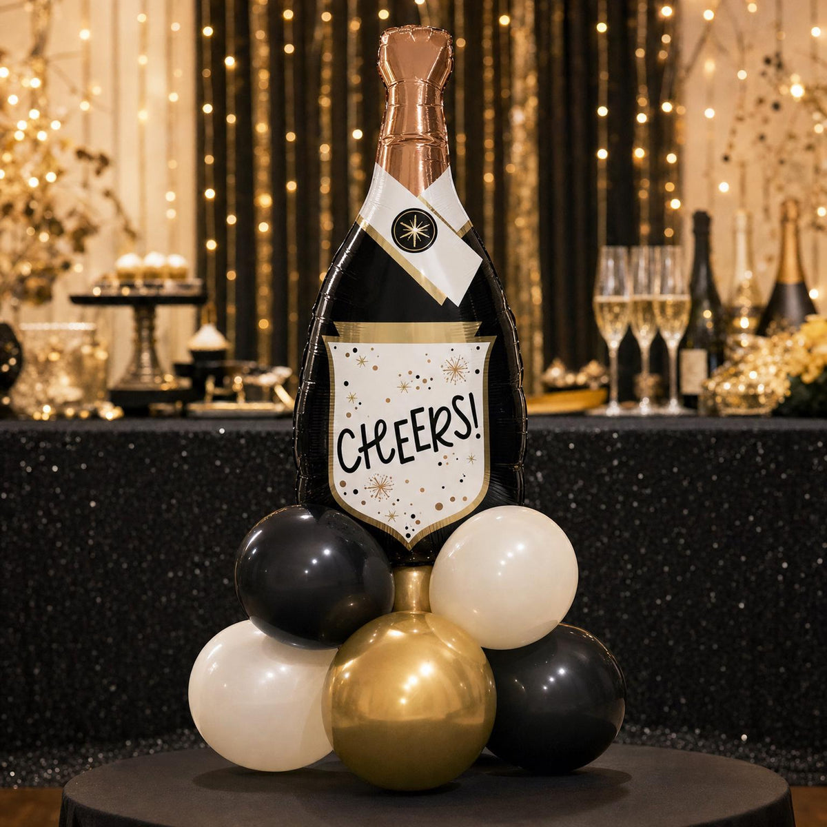 Cheers To 2027 balloon tower: 8 latex balloons topped with a Champagne Bottle foil